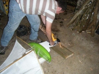 Sparks fly as Douglas uses the angle grinder to cut excess off the lead ballast on the keel. Photo: SR